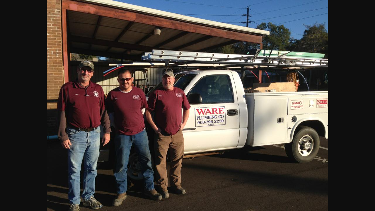 Ware Plumbing team with service truck